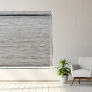 Gray Textured Blackout Roller Blind with a chain mechanism in a minimalist room setup featuring plants and a modern chair.