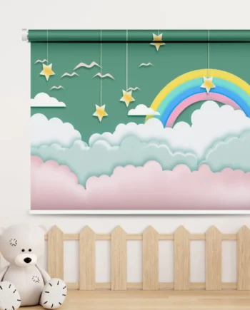 A whimsical roller blind with a rainbow, hanging stars, fluffy clouds, and birds on a green background in a cozy kids' room.