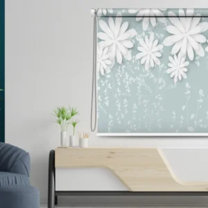 Floral roller blind with a soft blue background and white 3D-effect flowers, styled in a modern interior.