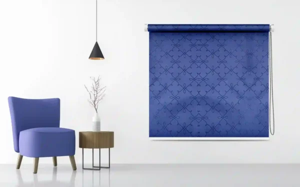 Elegant blue patterned roller blind with a lattice design, adding a modern touch to home decor, displayed in a minimalist living space with a matching blue chair.