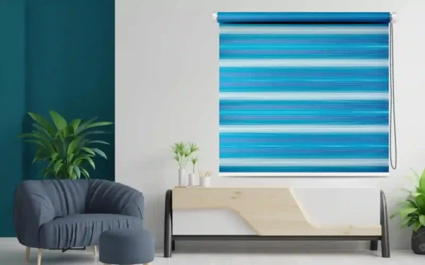 Modern blue zebra blind with gradient stripes, offering adjustable light control, displayed in a stylish room with contemporary furniture and greenery accents.