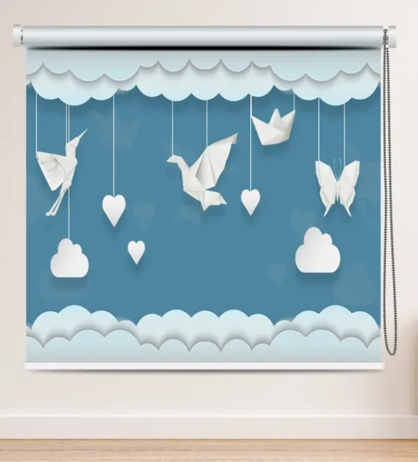 Whimsical Sky Origami Roller Blind with blue sky background featuring hanging origami paper birds, hearts, clouds, butterfly, and paper boat in a whimsical design